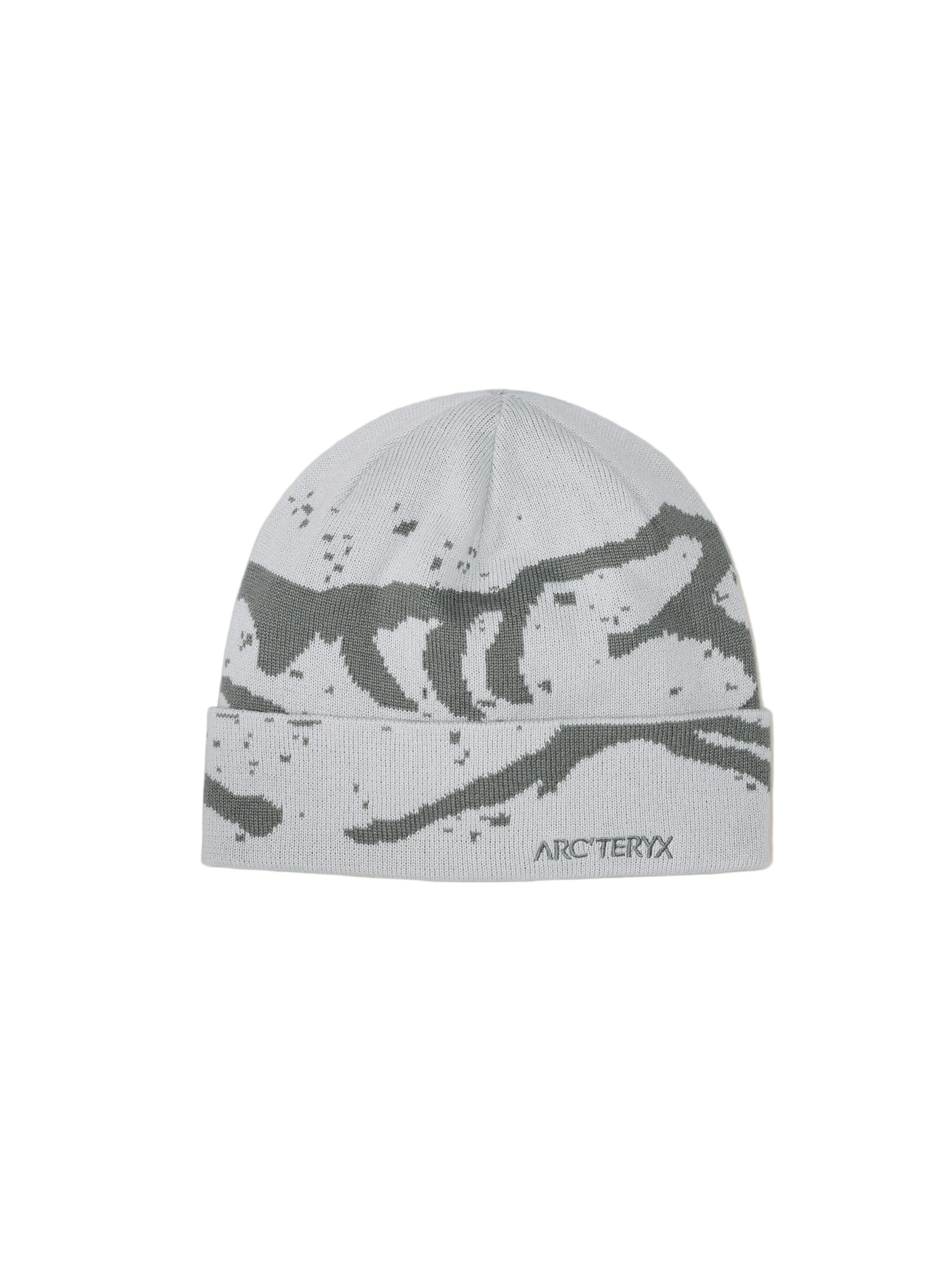 Gray beanie with black pattern and Arc'teryx logo on a beige background